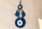 Amuleto protector Nazar de pared – Ojo turco de cristal con colgante y borlas azules