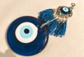 Amuleto protector Nazar de pared – Ojo turco de cristal con colgante y borlas azules