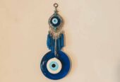Amuleto protector Nazar de pared – Ojo turco de cristal con colgante y borlas azules